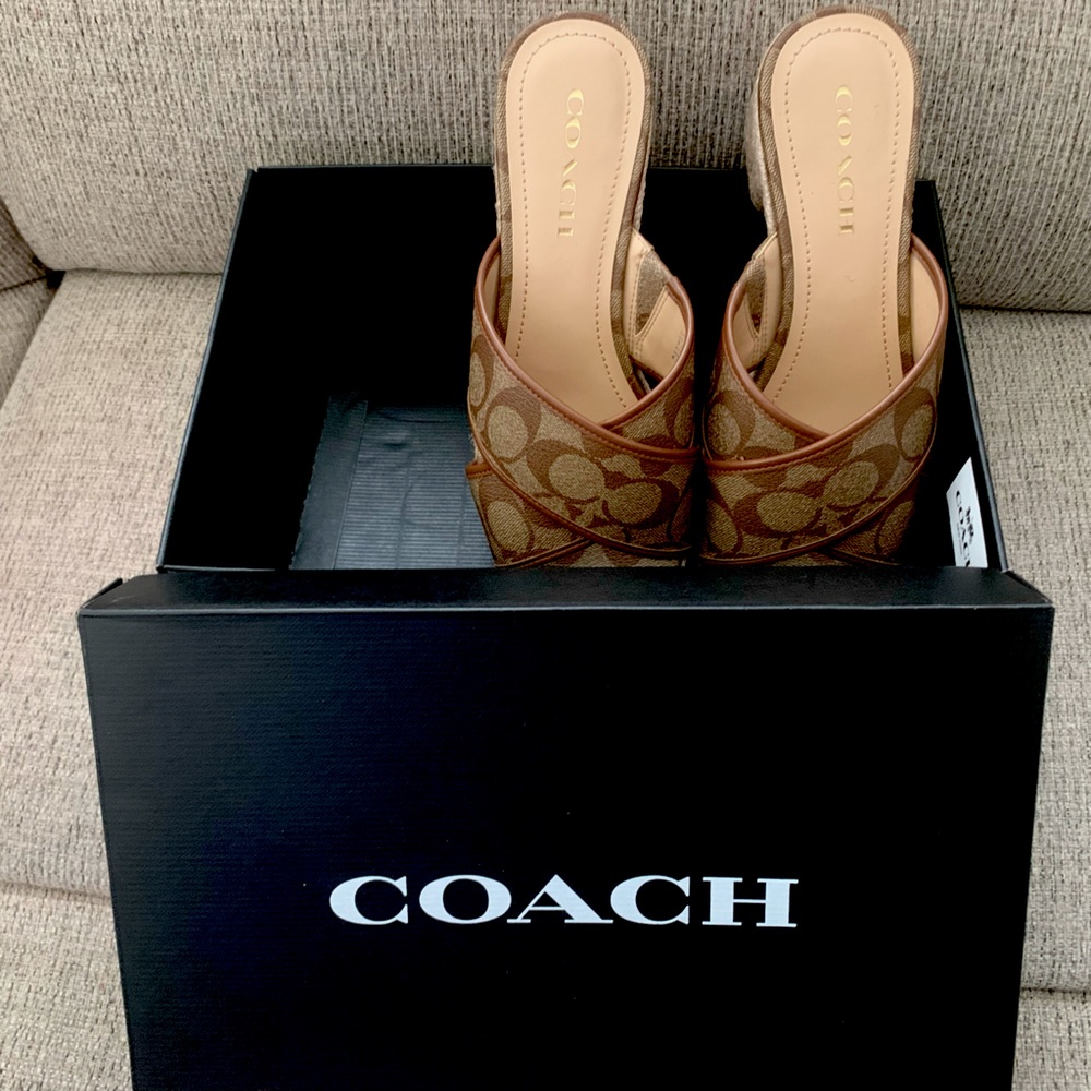 New with original box Coach brown and beige slide sandals. 1 1/2 inch heel